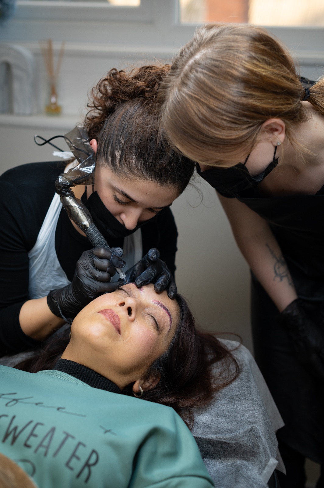 Close-up of professional brow technique training